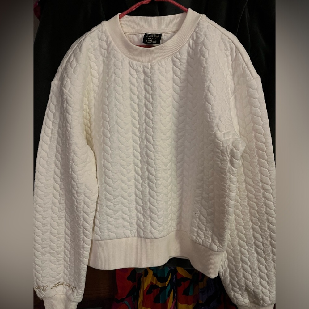 Cream color new without tags, long sleeve cozy top.  Never worn